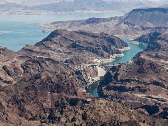 Aerial image of Hoover Dam showing water and desert landscape