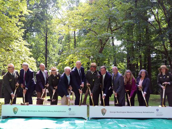 National Park Service Director and other federal and local leaders holding shovels for a groundbreaking ceremony