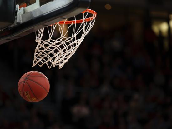 Photo of basketball going through hoop