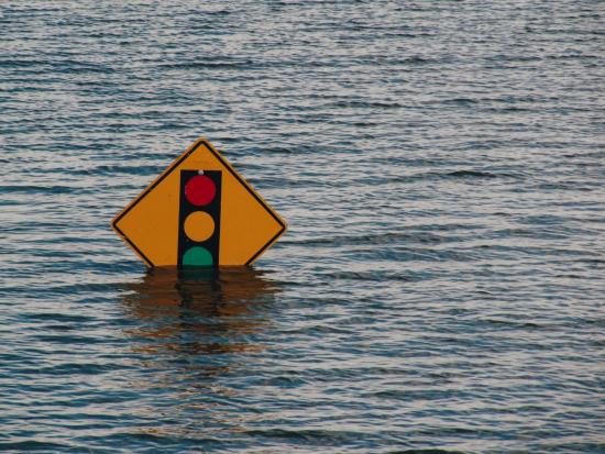 Photo of Road Sign Under Flood Water
