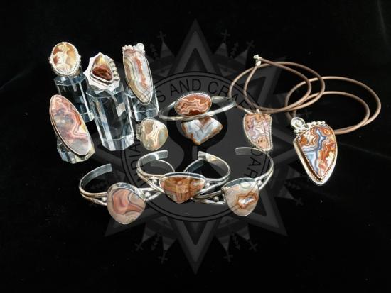 Photograph of silver and agate bracelets and other jewelry.