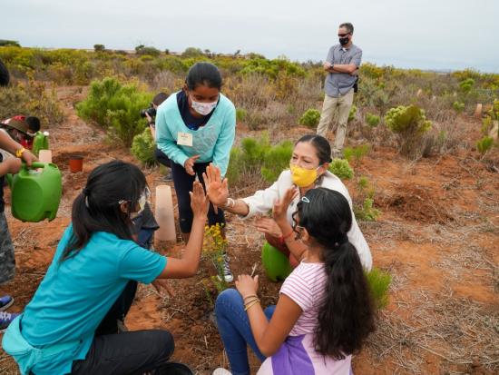 Secretary Haaland and group of youth at San Diego National Wildlife Refuge. 
