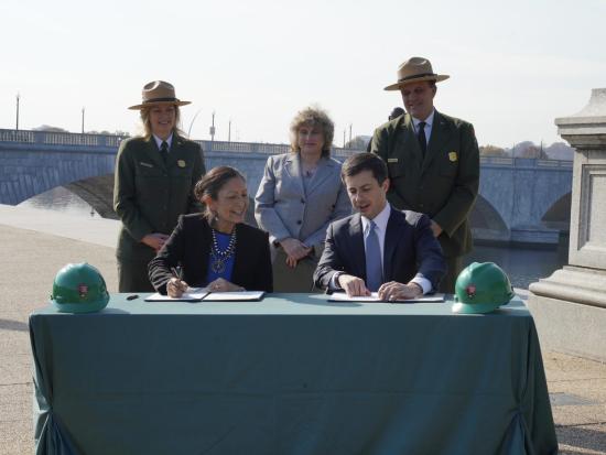 Secretaries Haaland and Buttigieg sign a MOU