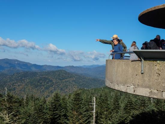 Secretary Haaland and Park Ranger on an overlook structure