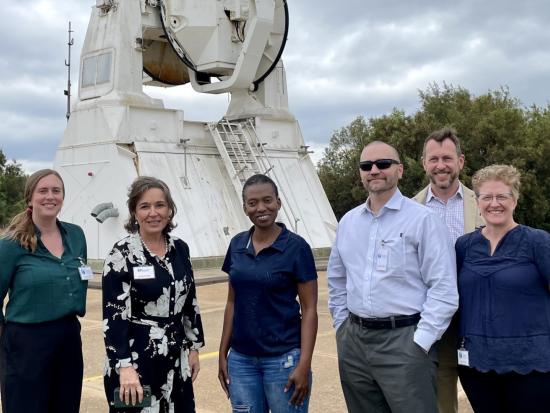 Assistant Secretary and USGS Director stand with 4 others on South Africa visit.