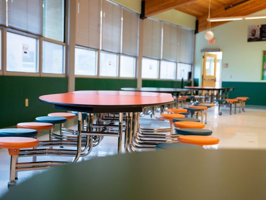 Cafeteria tables and chairs inside Wingate Elementary
