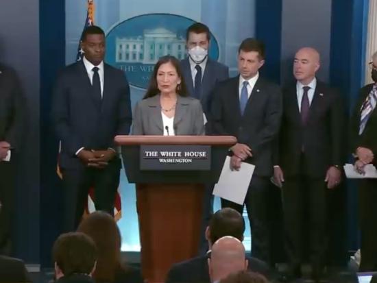 Secretary Haaland and other Cabinet secretaries behind White House podium 