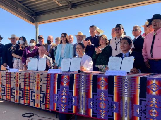 Secretary Haaland holds up water rights agreement at signing ceremony 