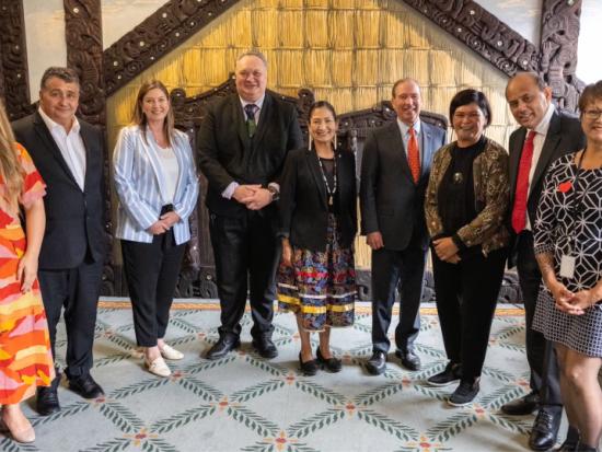 Secretary Haaland and U.S. Ambassador Tom Udall pose with others during their visit to New Zealand