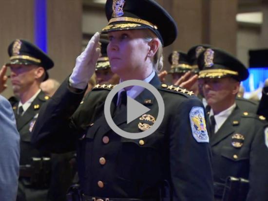 Law enforcement officers salute at a Police Week ceremony in Washington, D.C.  