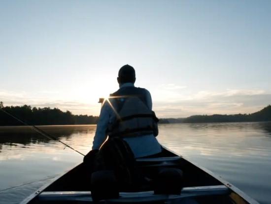 Man in canoe on lake