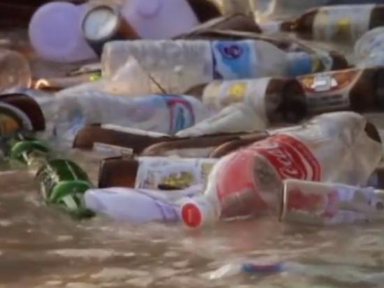  Discarded plastic bottles floating in the water