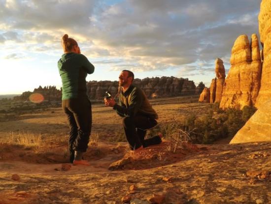 man proposing to woman at national park 