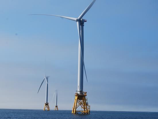 Wind turbines in ocean water.