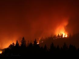 Flames rise from the 2021 Ford Corkscrew Fire in Washington State at night. Photo by KS Brooks, USFWS.