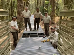 A U.S. Fish and Wildlife Service maintenance action team improves accessibility on the Woodpecker Loop Trail