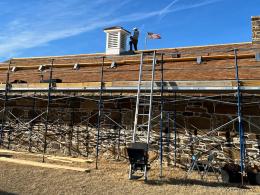 Scaffolding on the back side of the Quartermaster warehouse.