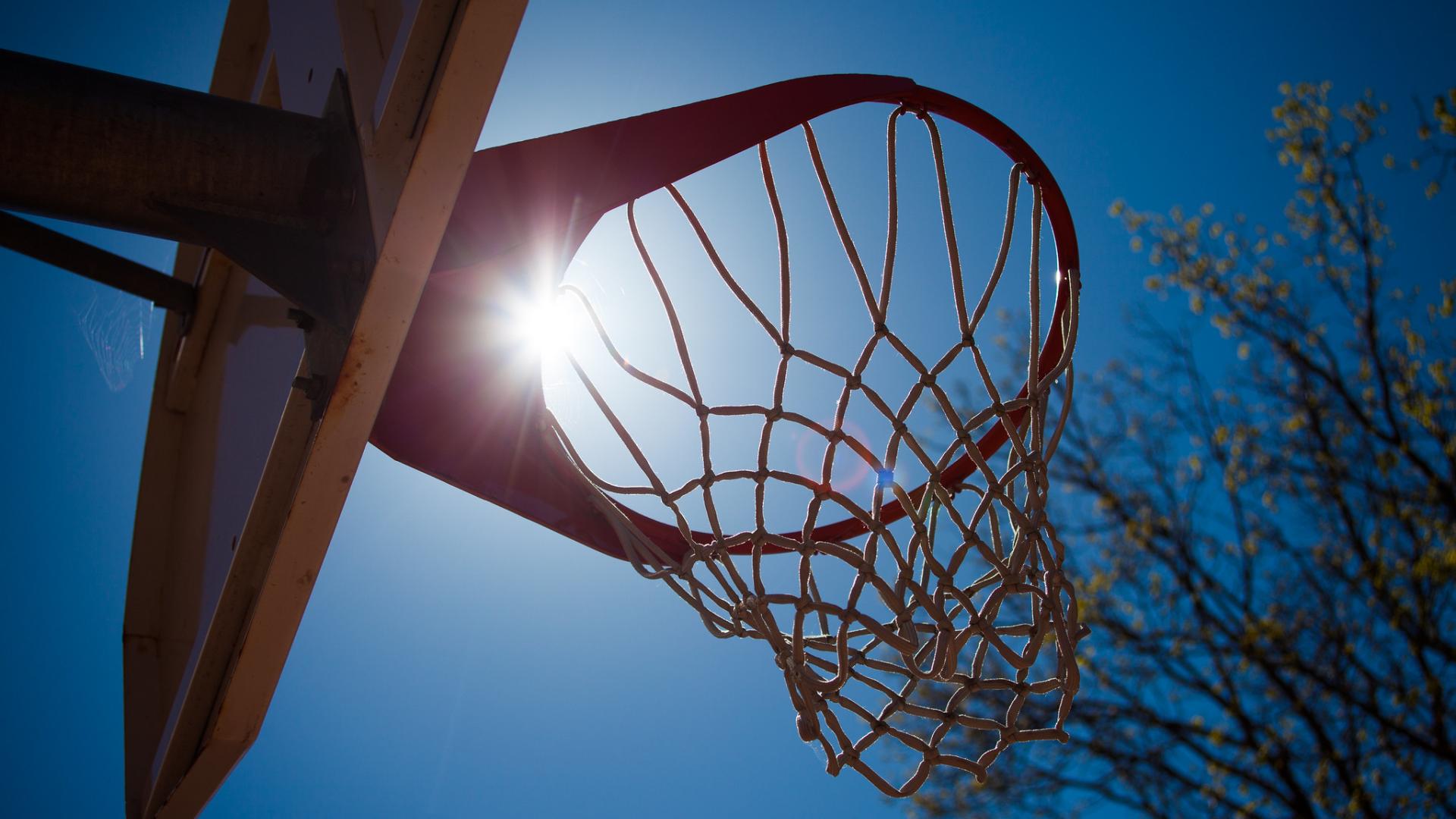 Photo of basketball hoop in the sun