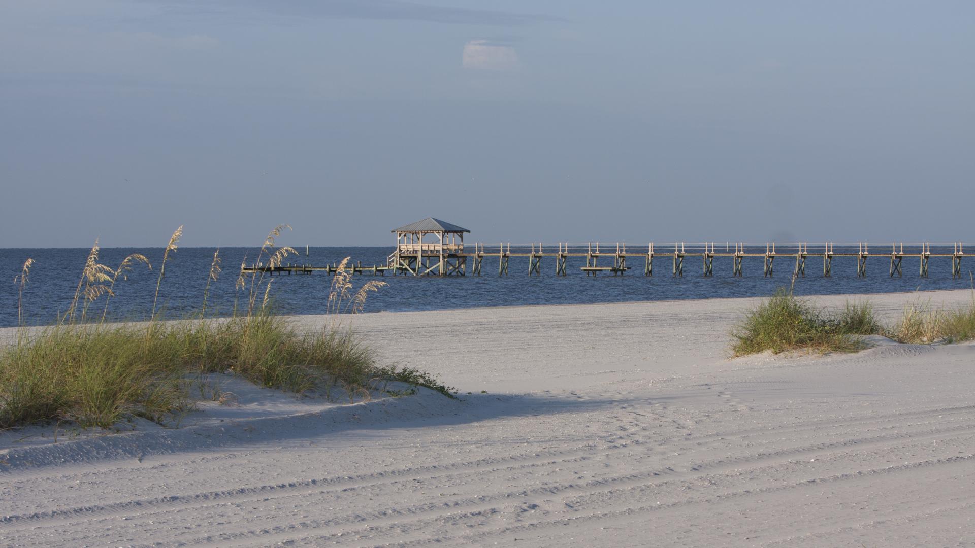 Mississippi Gulf Coast, beach view looking out at dock in the water