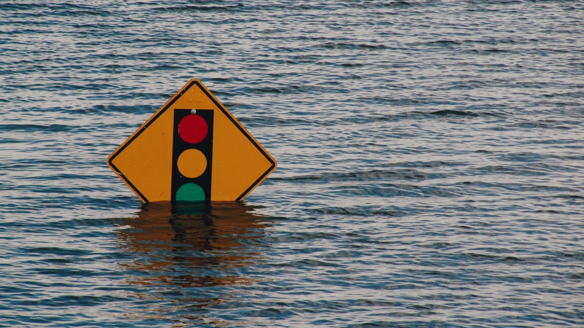 Photo of Road Sign Under Flood Water