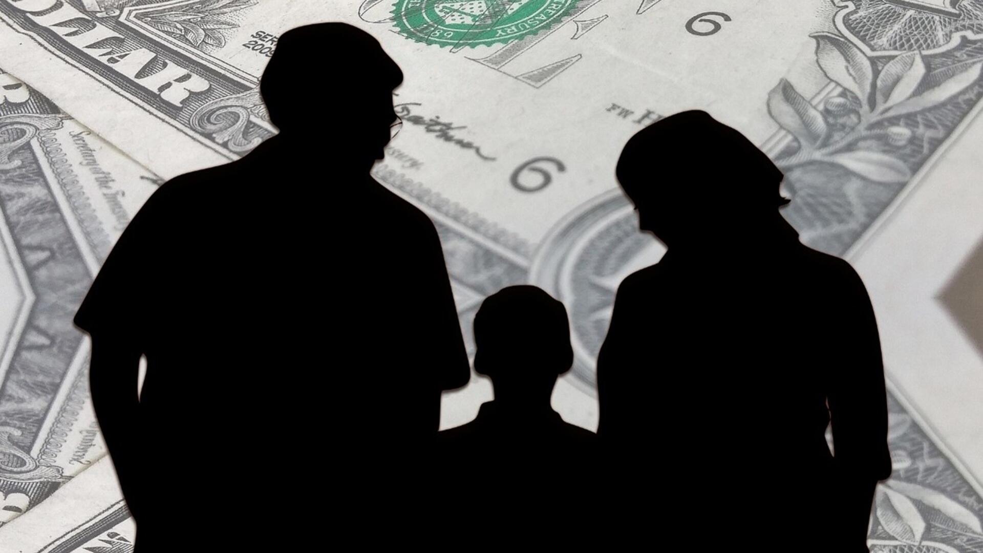 Outline of family with dollar bills in background