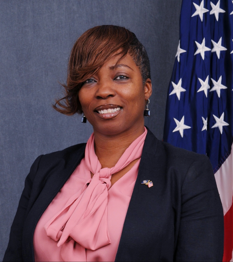 Portrait of Tonya R. Johson-Simmons in front of American flag. 