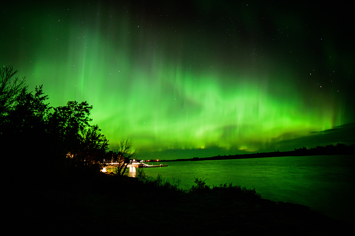 Green Northern Lights reflected along the river. 