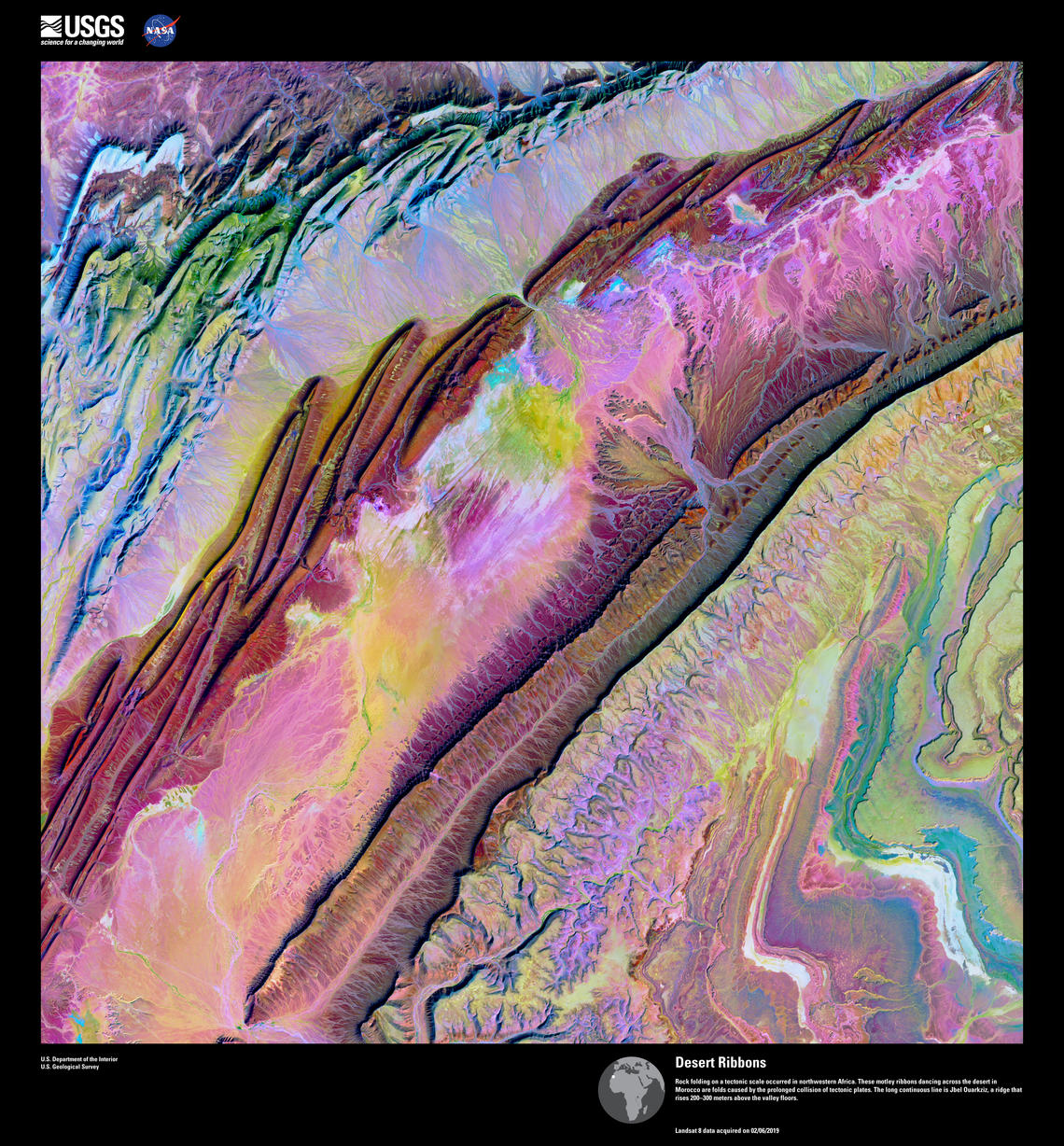 Pastel streaks of pink, green, brown, and purple across a desert.