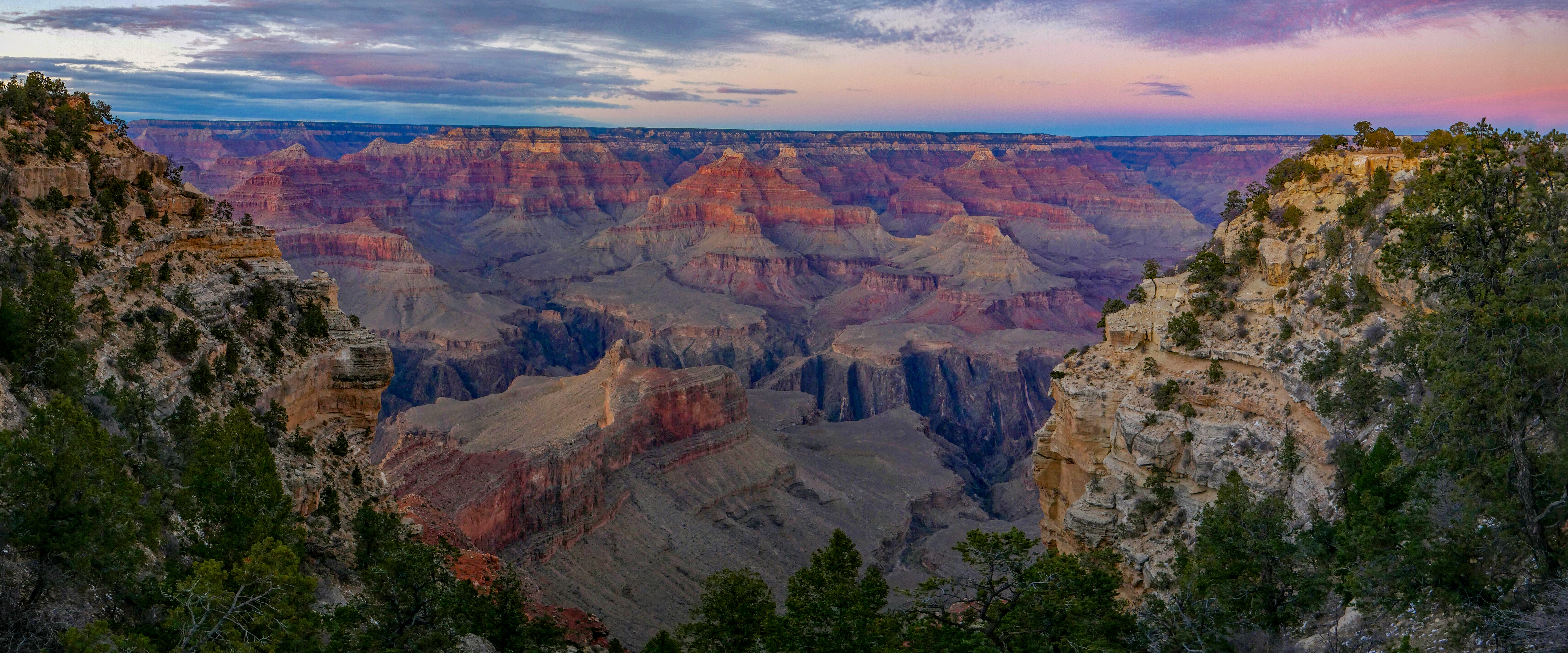 Soft glow of twilight illuminating this vast canyon landscape, just after sunset.