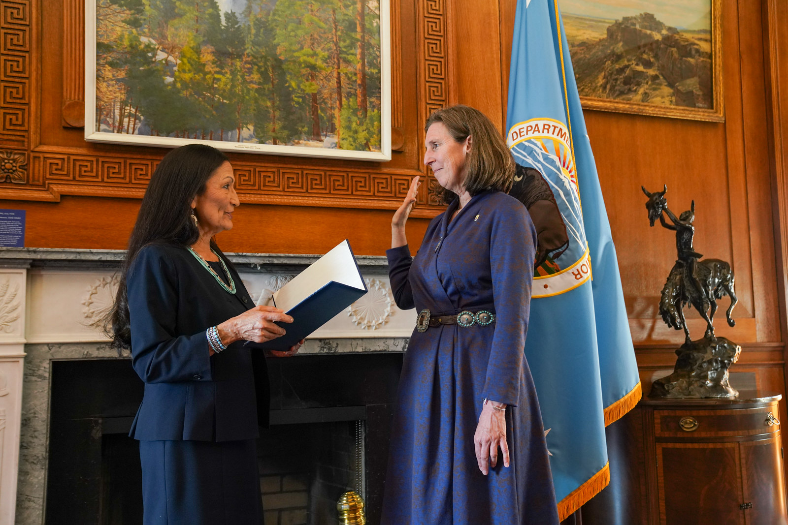 Martha Williams being sworn in by Secretary Haaland.