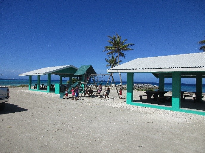 Photo of playground and picnic shelters at Ebeye beach park.