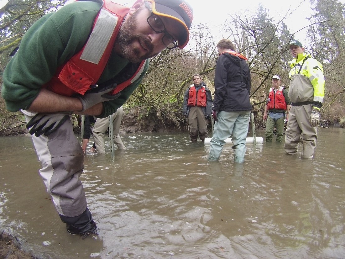 Steven Sobieszczyk and fellow hydrologists in a stream.