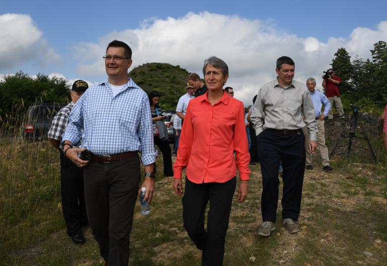 Secretary Jewell speaks with officials from the Pennsylvania Department of Environmental Protection Secretary Jewell walks on a dirt path with Ehrenfeld officials.