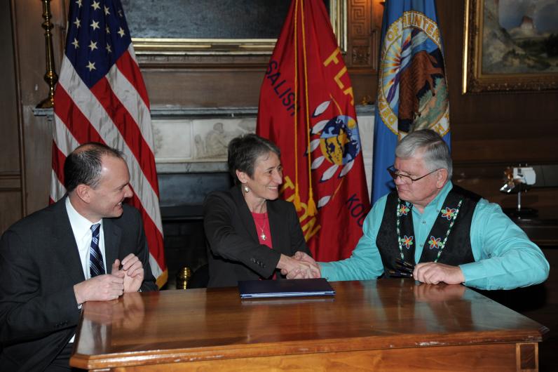 Jewell and Trahan shaking hands