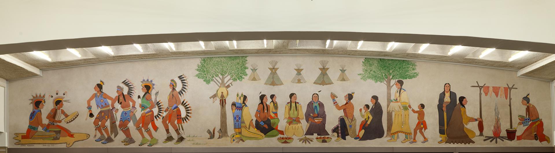 Kiowa dancers, drummers, and women preparing food frame this mural of a harvest feast.