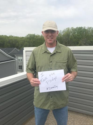 Brent Range from OS holding the I Took the Pledge Sign