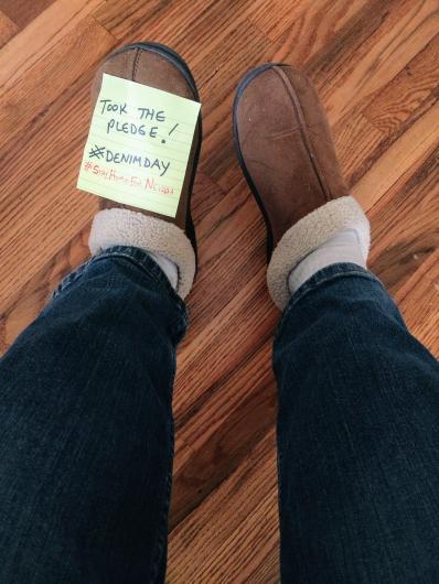 David Pritchett from BLM showing only his legs on jeans, on sleepers, I took the Pledge #DenimDay written on a sticky note. 