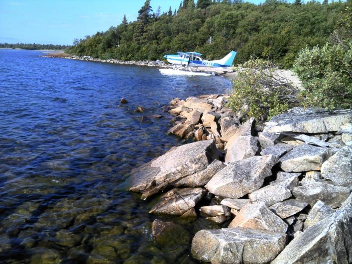 Fox Bay, Lake Iliamna A float plane rests on the lake near the shore
