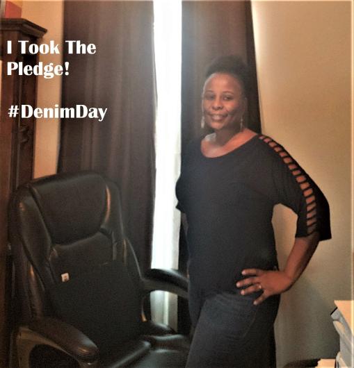 Linda Walker (BIA) standing looking at the camera, written on image, the I took the Pledge #DenimDay words.