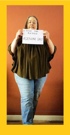 Liz Dawson from FWS holding the I took the Pledge #DenimDay sign. Photo framed in yellow color 