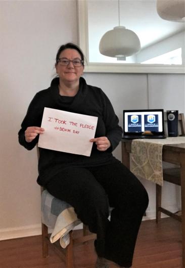 Shelby Hagenauer from USBRB holding the I took the Pledge #DenimDay sign.