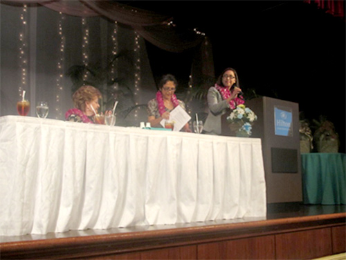 Asst. Secretary Kia’aina delivers remarks at the Guam Women’s Chamber of Commerce Luncheon. Also seated at table is Guam Congresswoman Madeleine Bordallo.