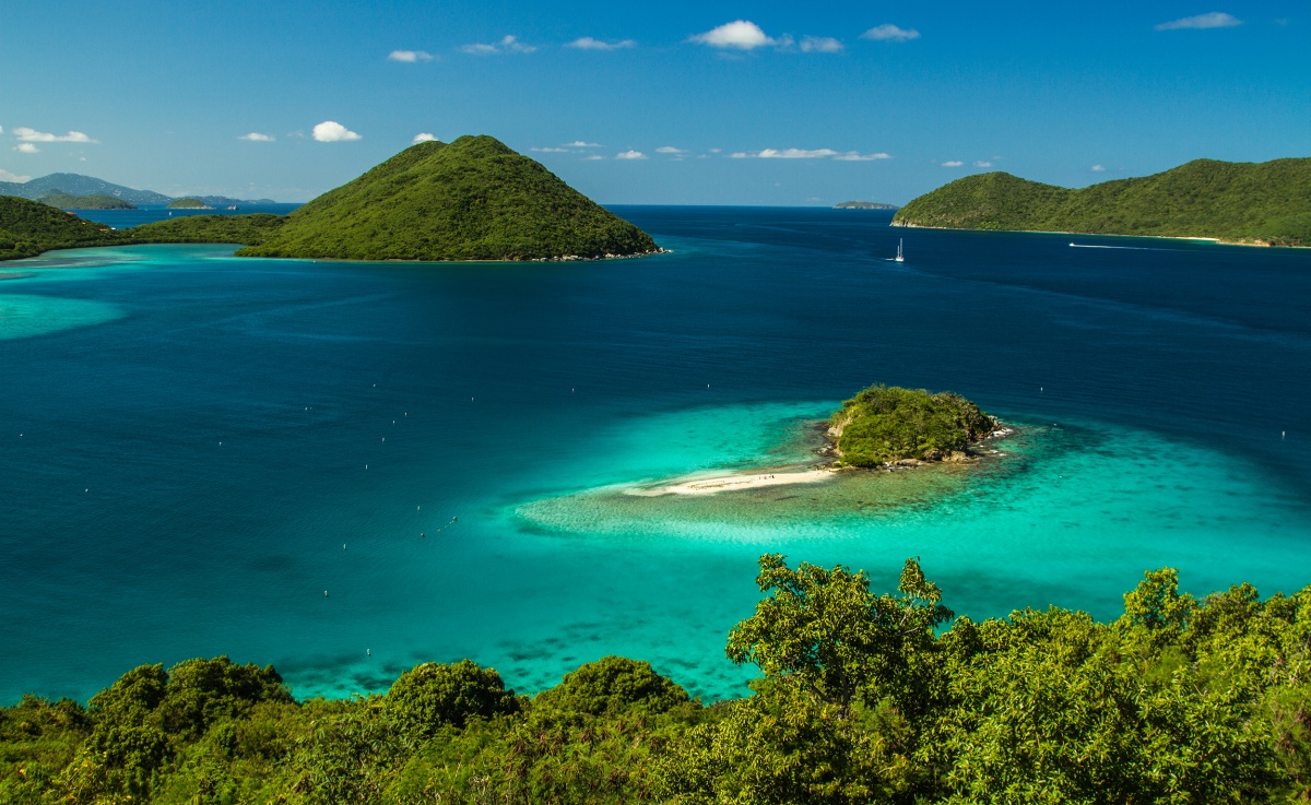 white sand, blue water, green vegetation