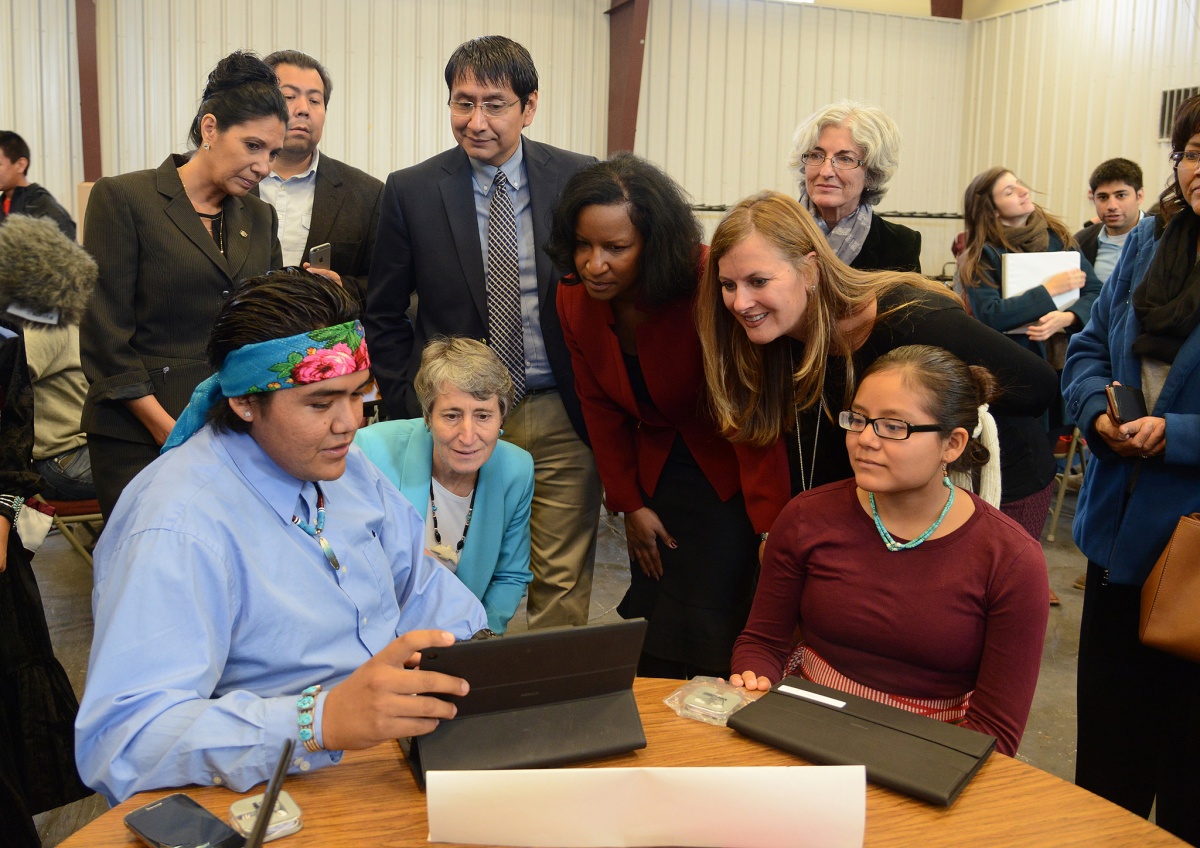 Secretary Jewell watching a student demonstrate a computer program.