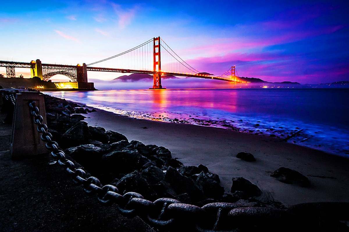 pink and blue sky, golden gate bridge, black shoreline