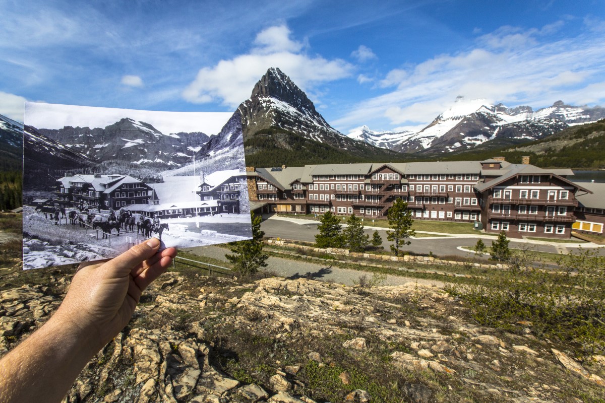 An historic photo of a hotel with a large group of horseback riders milling about outside is held next to the same hotel in the modern day with rocky snow-capped mountains towering overhead.