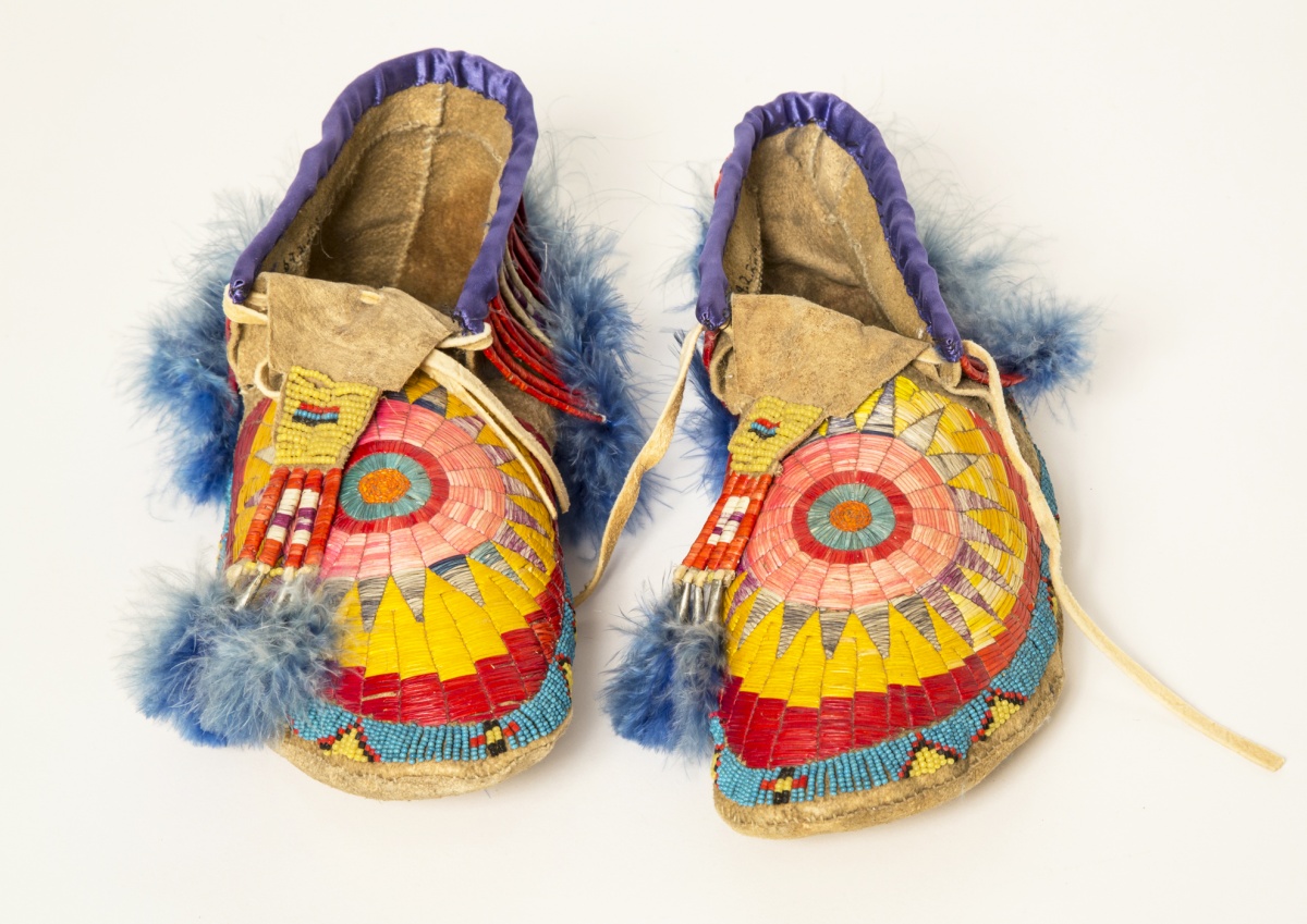 An elaborately decorated pair of Native American shoes.