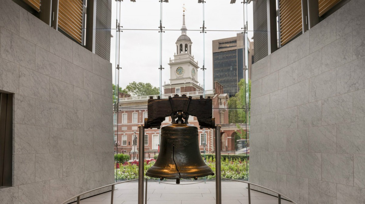 Liberty Bell with Independence Hall in the background.