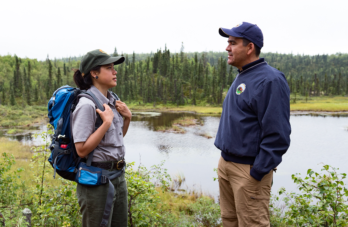 Deputy Secretary Connor talks to a young female Park Ranger.