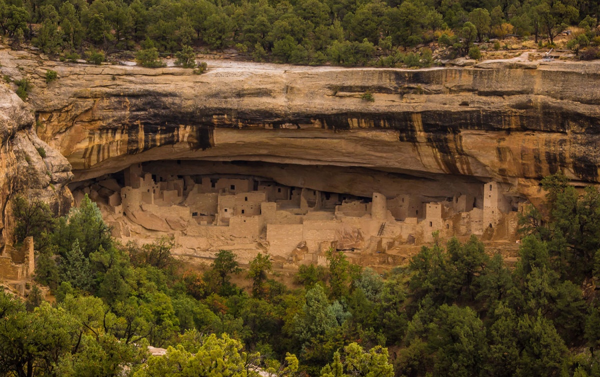 cliff dwellings in the side of a mountain